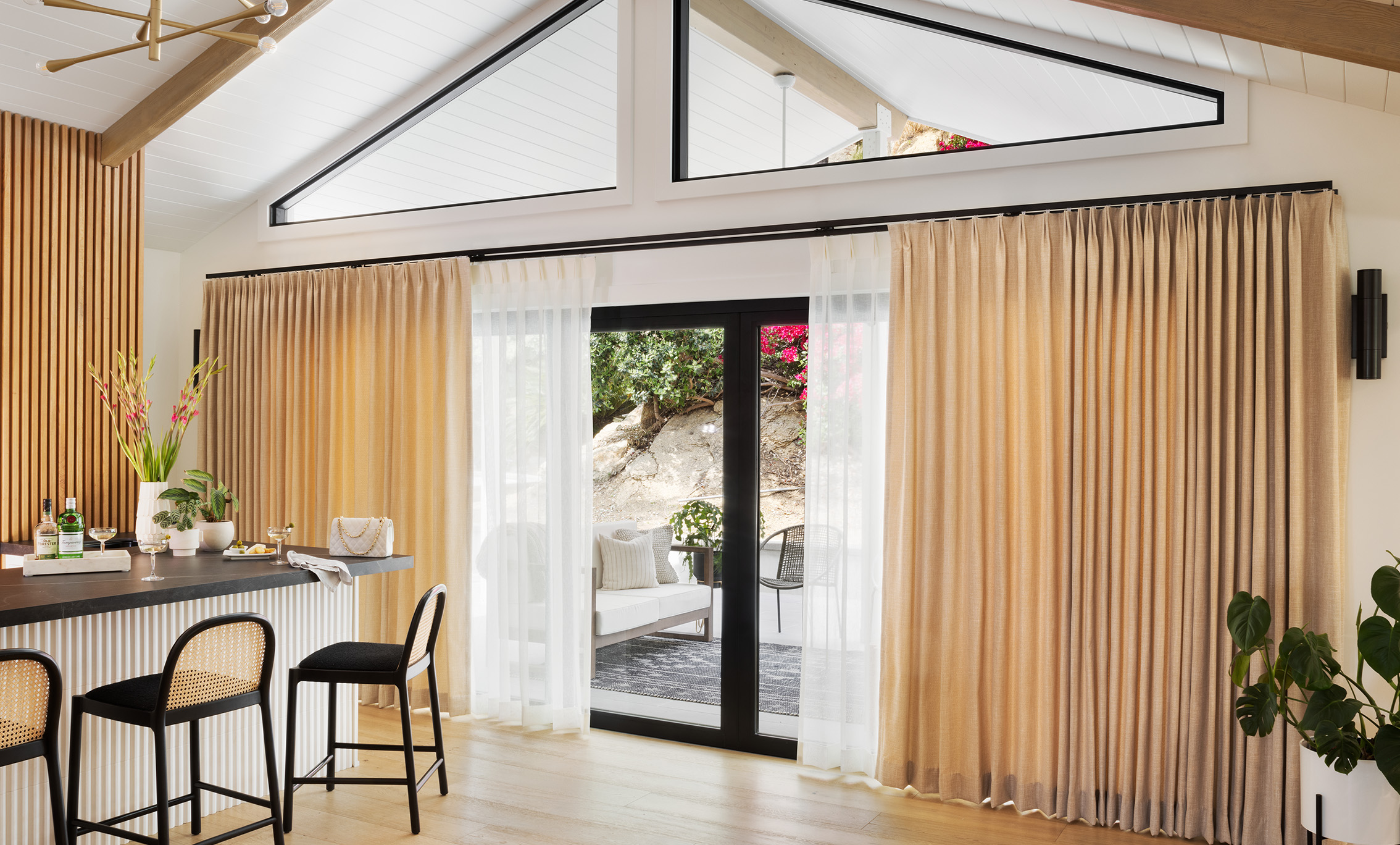 Multiple Drapery Panels on a wall in a bedroom